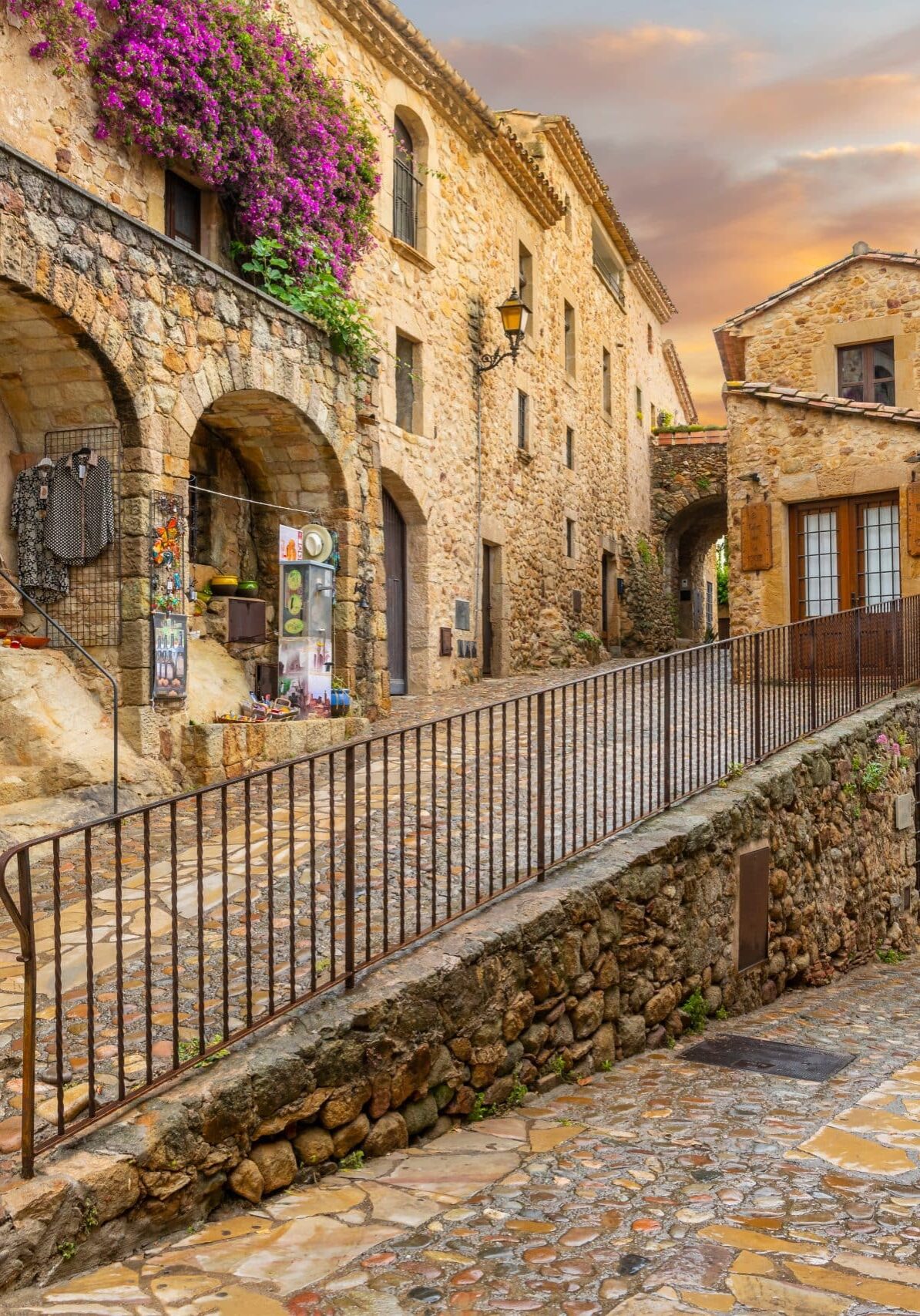 The medieval Spanish village of Pals in the Costa Brava region of Southern Spain as the sun sets after a summer rainstorm.